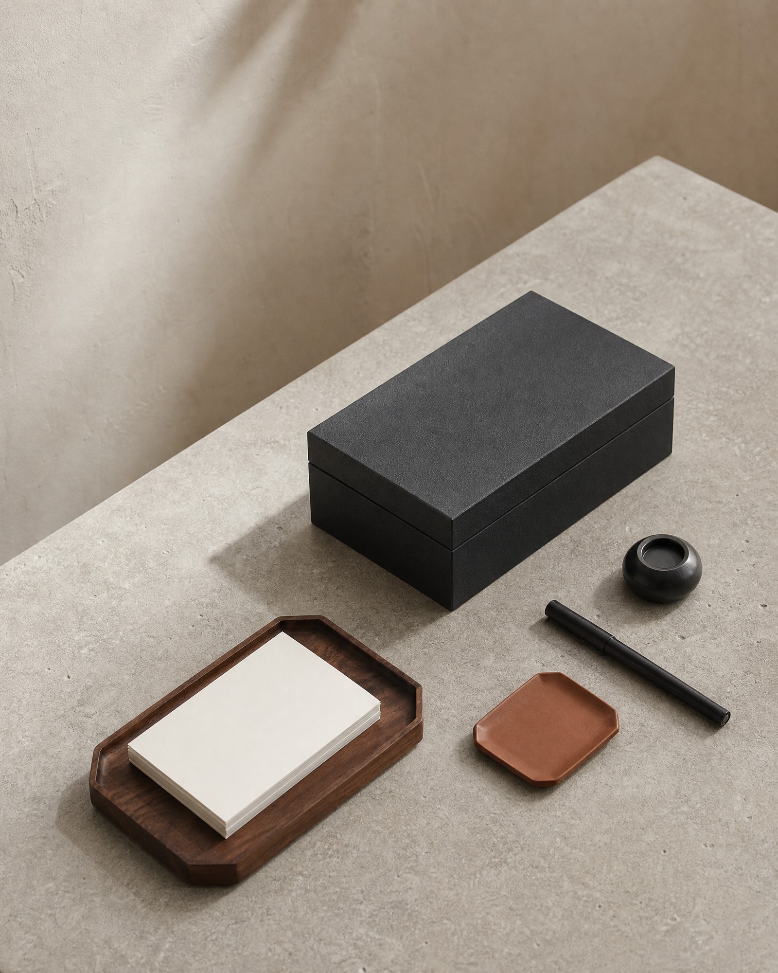 Tabletop storage boxes and tray organizing a writing desk